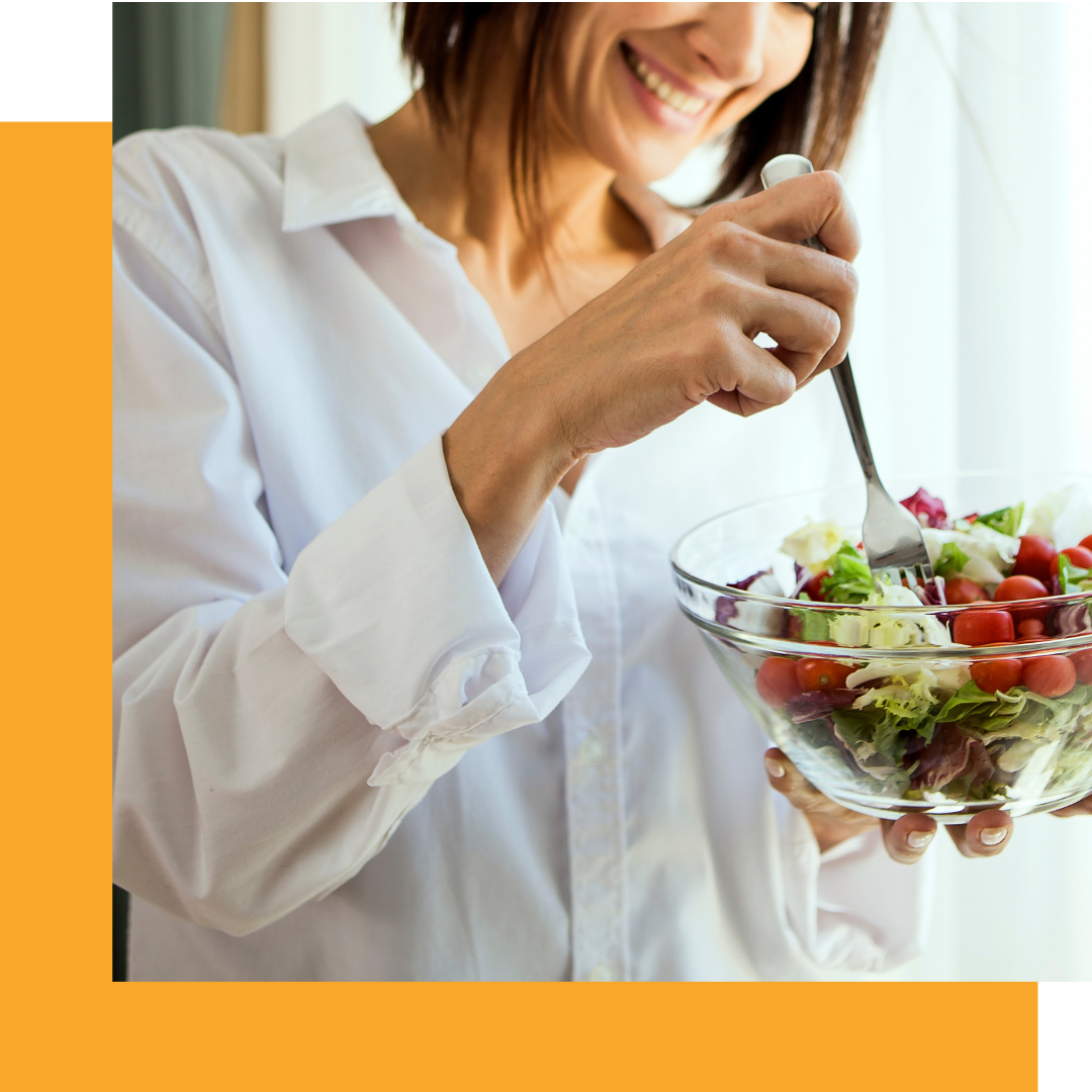 Image of a woman eating a salad